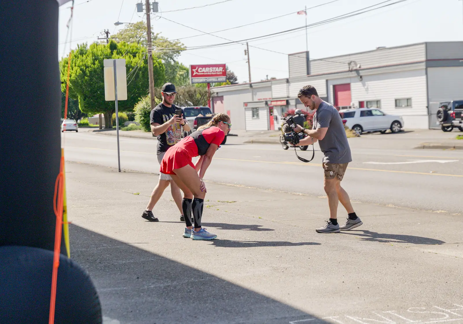 Ultra Nomadic Media videographer filming an ultramarathon runner at the finish with a gimbal camera